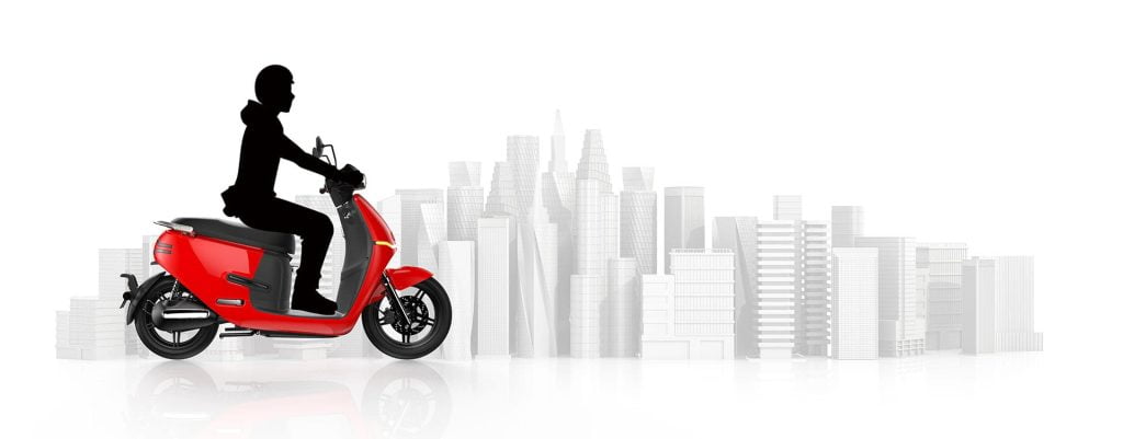 red cgi scooter riding across silhouetted city