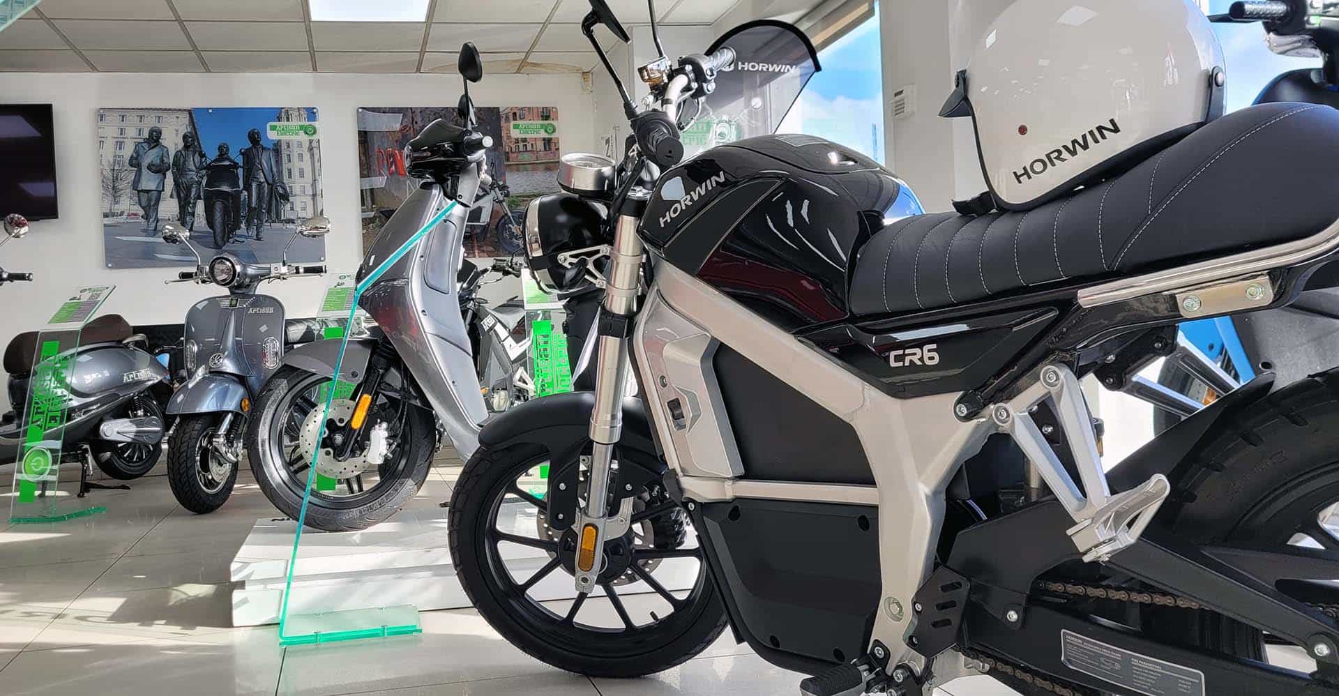 Black electric motorbike and electric scooters inside Checkpoint showroom