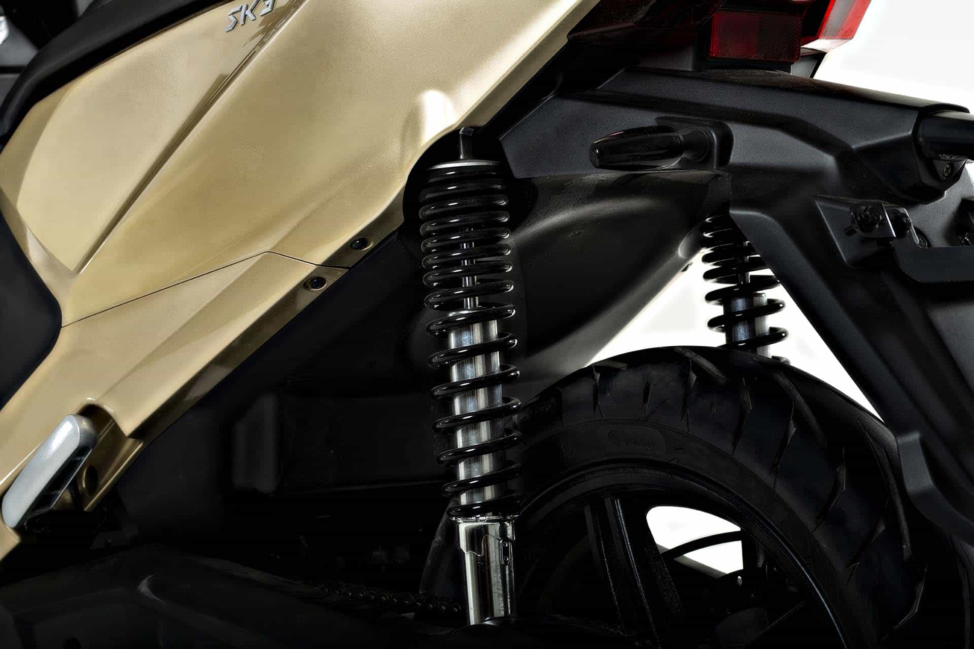 Suspension springs on gold SK3 scooter