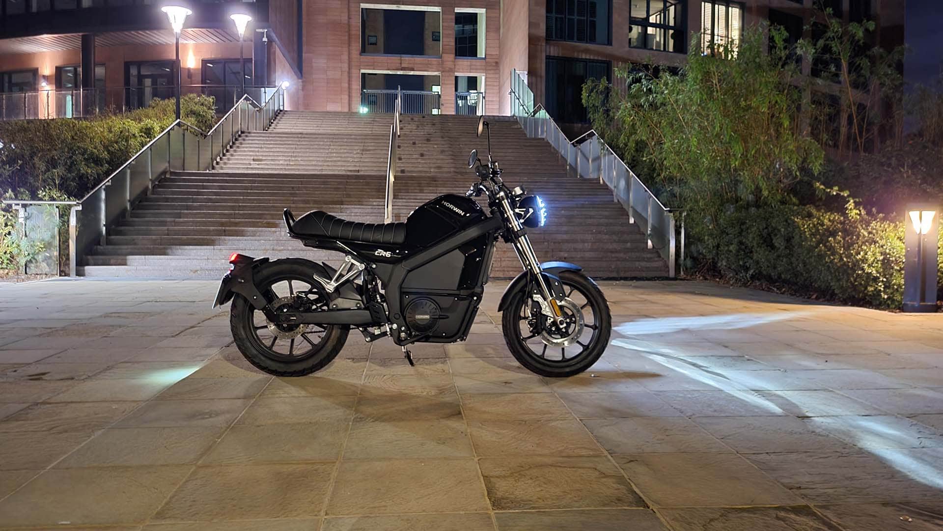 Black electric motorbike at the bottom of concrete steps