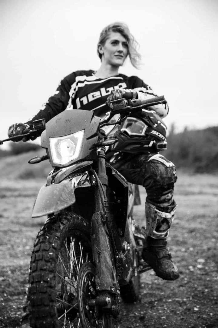 Black & white image of The Girl on the Bike sitting on ES1
